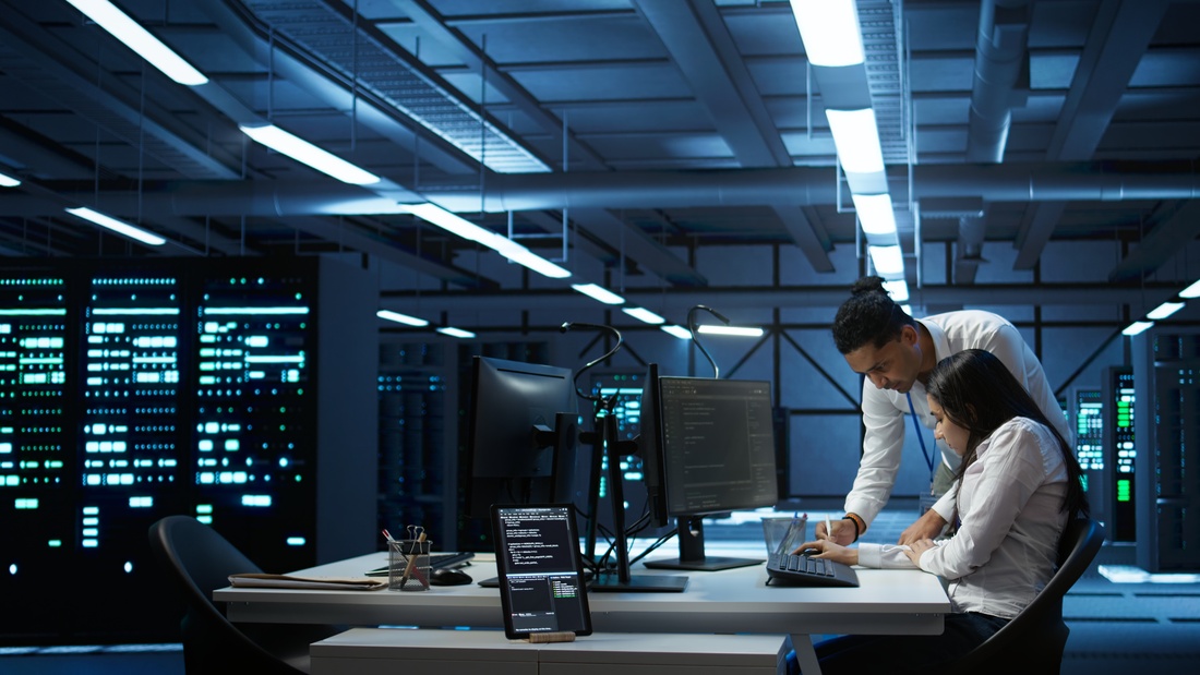 Team of specialists updating server room systems
