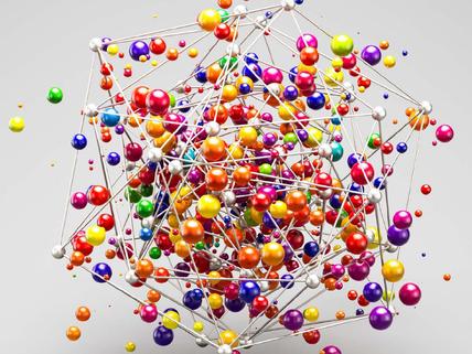 A metalic structure containing colourful ball structures