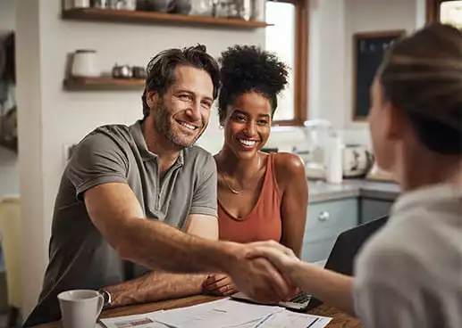 man and woman smiling through meeting