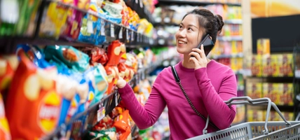 woman shopping while on mobile device