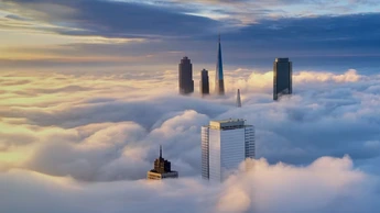 Aerial View of a city on Thick Cloud