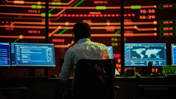 Professional IT Technical Support Specialists and Software Developer Working on Computers in Monitoring Control Room with Digital Screens with Server Data, Blockchain Network and Surveillance Maps