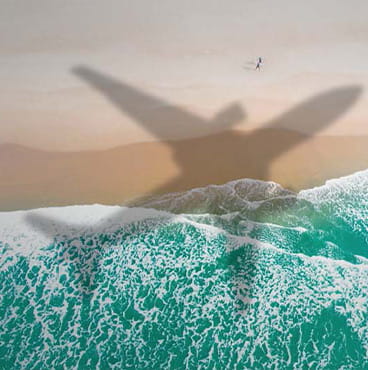 airplane shadow on beach