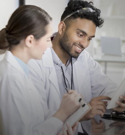 two healthcare professionals working