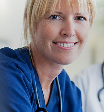 nurse smiling and looking