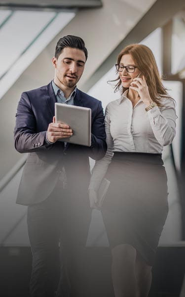 colleagues talking to each other while walking