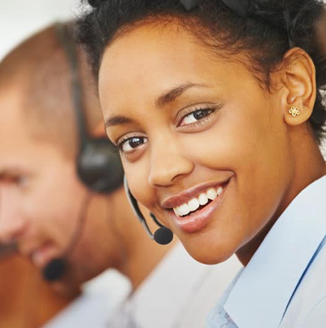 female call center executive smiling at camera