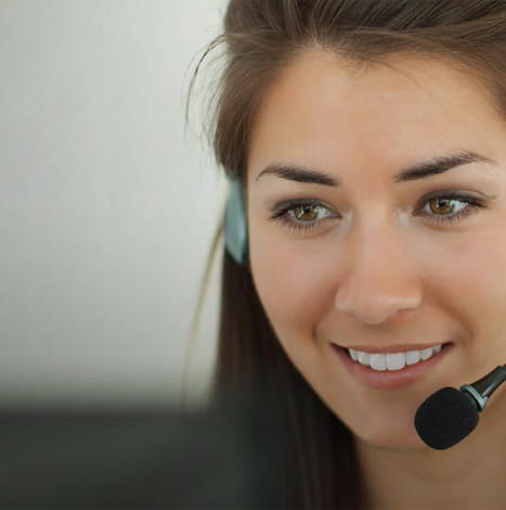 Women talking with customer in call center