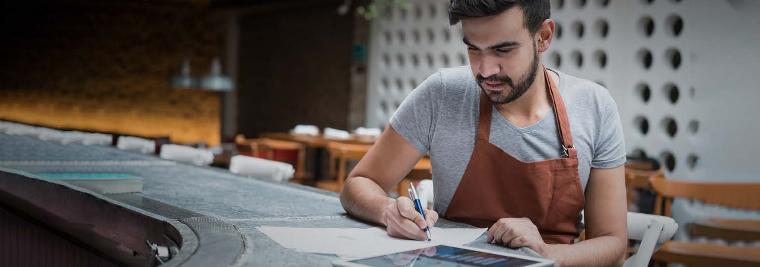 men writing on the paper