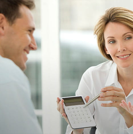 women showing the calculator with men