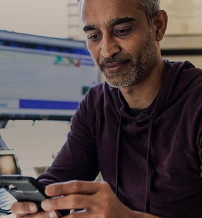 man looking at mobile screen