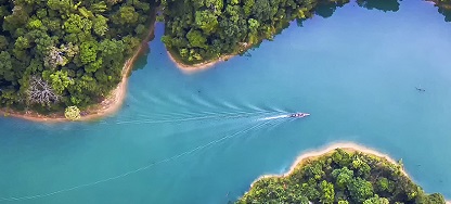 overhead view of blue water and green landscape