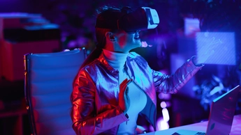 Curious woman using virtual reality technology in office