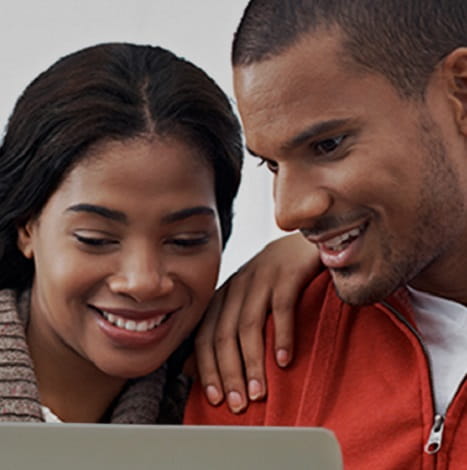 man and woman smiling together