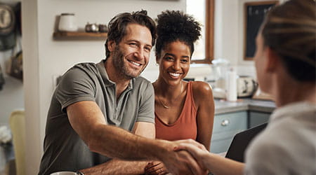 man shaking hands during casual meeting