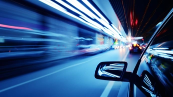 The car in night motion blur.