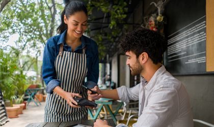 mobile banking at outdoor cafe