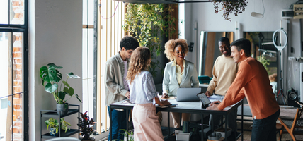 A Group Of Happy Multiethnic Businesspeople Working Together In The Office