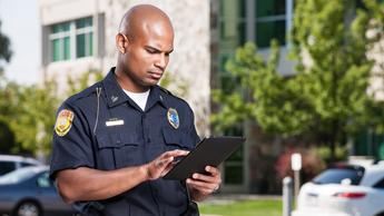 police officer using a tablet