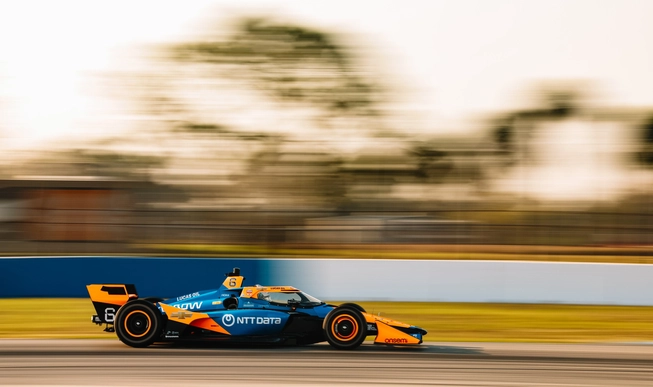 Man driving formula racing car