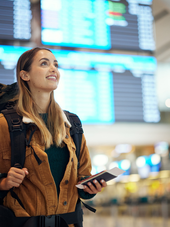 Travel, airport and excited woman with passport. travel ticket and documents for immigration, journey and flight schedule. Backpack person with identity document search for international registration