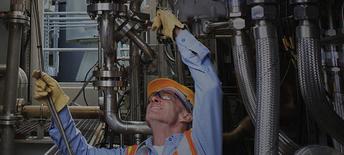 Engineer examining instrumentation cables