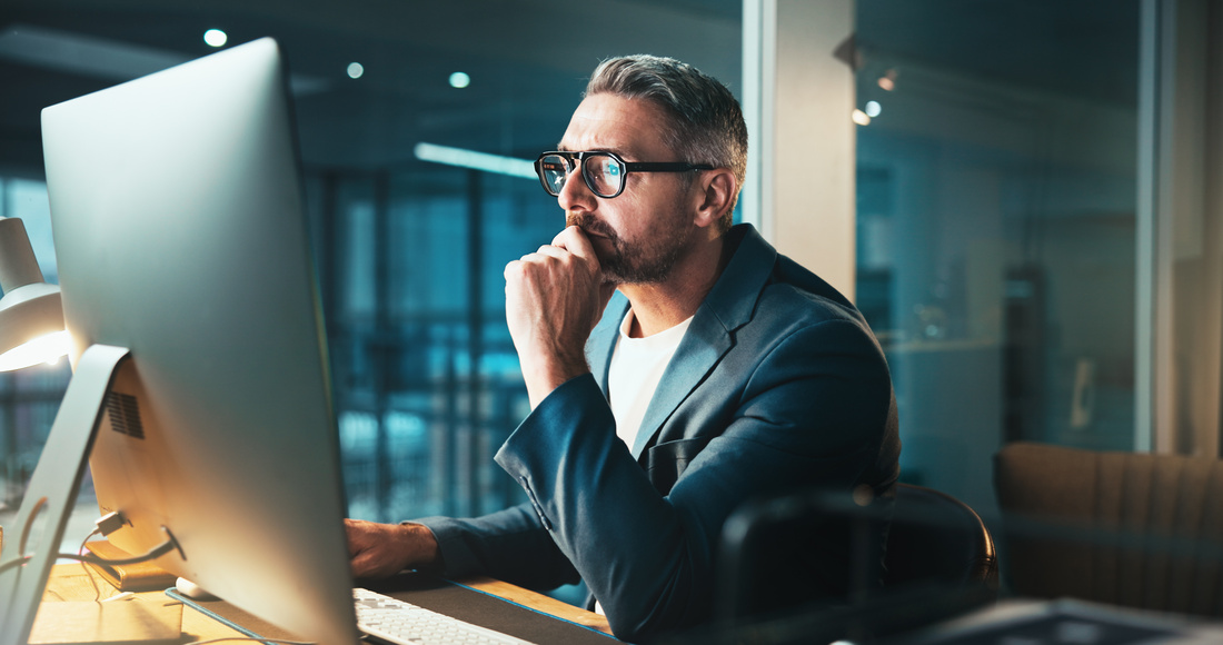 Man, programmer and thinking with computer at night for server programming, software update or deadline. Mature person, online and it for research of problem solving, system error and website upgrade