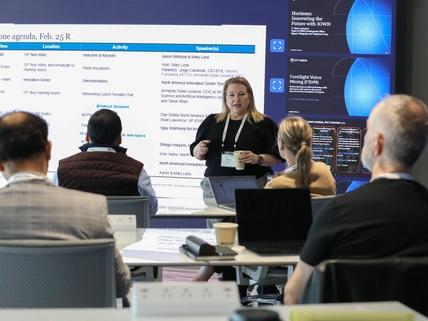 woman speaking to a group in a session