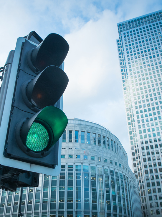 Green, Yellow and Red Traffic Light in the London city\n\n