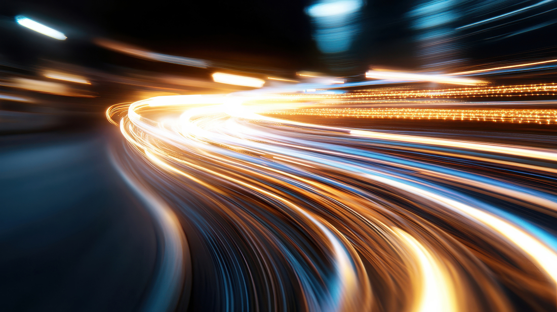 Dynamic streaks of light illuminate the urban nightscape, capturing the energy and movement of a bustling city as vehicles pass by, creating vibrant visual excitement.