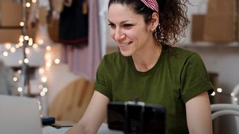 woman working from home on devices