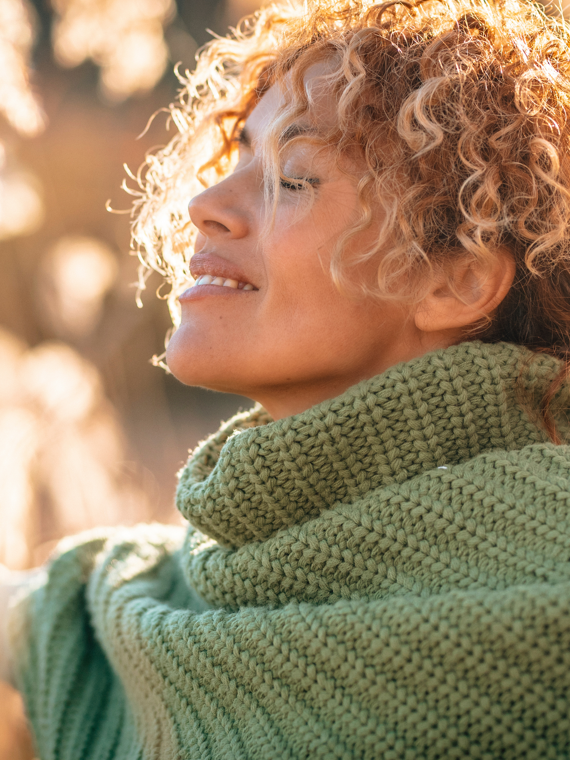 One beauty woman with happy and idyllic expression on face opening arm and enjoying sunset light in the field in scenic outdoor leisure activity. People loving life and healthy lifestyle concept. Life