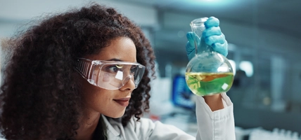 Scientist, woman and chemical with glasses in laboratory for chemistry experiment, test sample or research