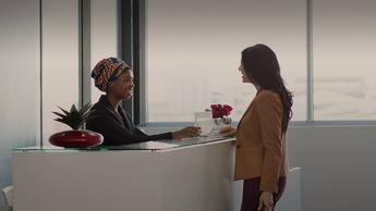 female executive at office reception counter