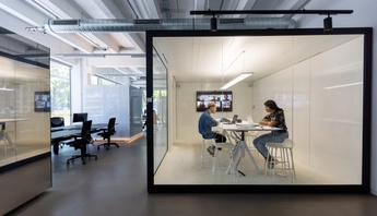 Business people working in hybrid office space