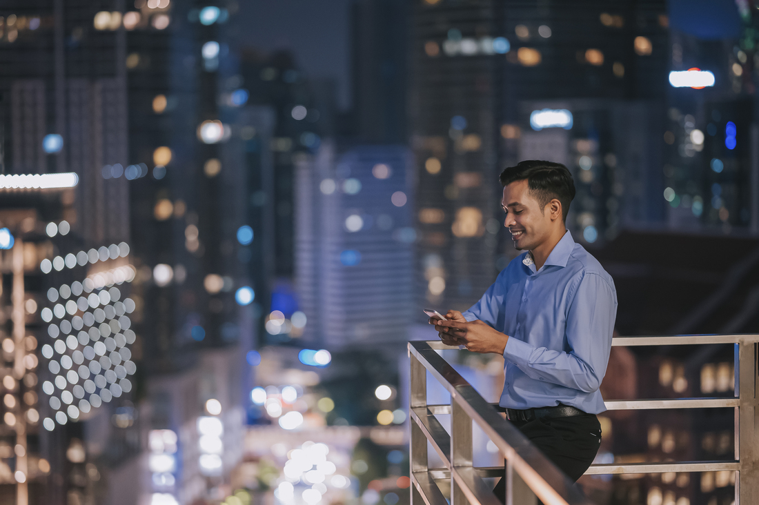Connectivity_Man Standing Balcony_GettyImages-1395732215.jpg