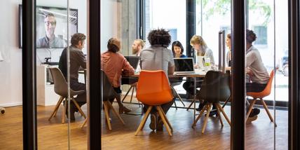 A group of people in a conference room