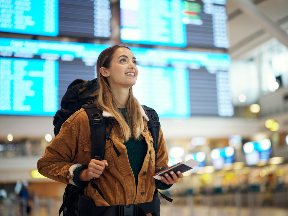 Travel, airport and excited woman with passport. travel ticket and documents for immigration, journey and flight schedule. Backpack person with identity document search for international registration