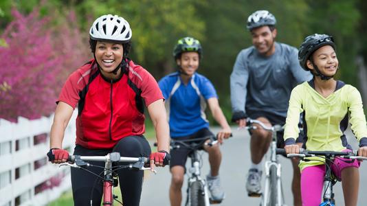 Group of family members enjoying a bicycle ride together