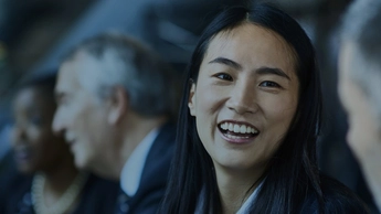 woman happily smiling at colleague