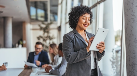 woman holding tablet