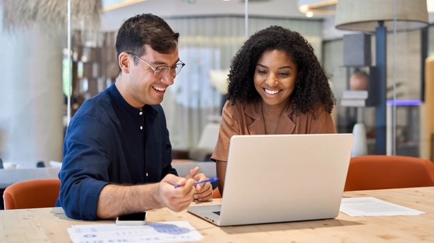 two colleagues at laptop