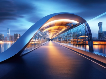 Modern architectural bridge at twilight over a city skyline