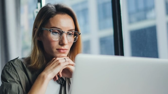 woman looking at laptop