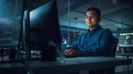 man working at computer screen