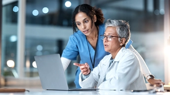 healthcare colleagues reviewing laptop screen