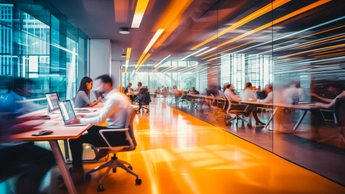 group of people working in office setting with image in motion