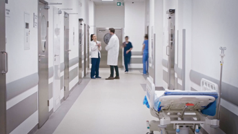 doctors conversing in hospital hallway