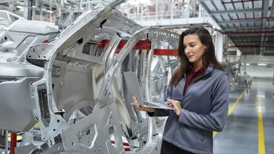 Employee is checking a machine status.