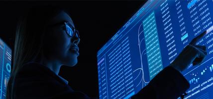 woman working on touch screen showing data